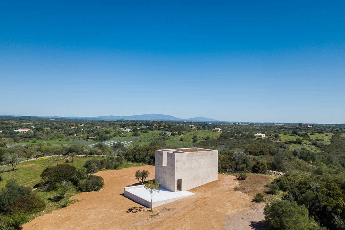 Álvaro Siza completes beige-colored Hillside Chapel in the middle of the natural landscape in Lagos