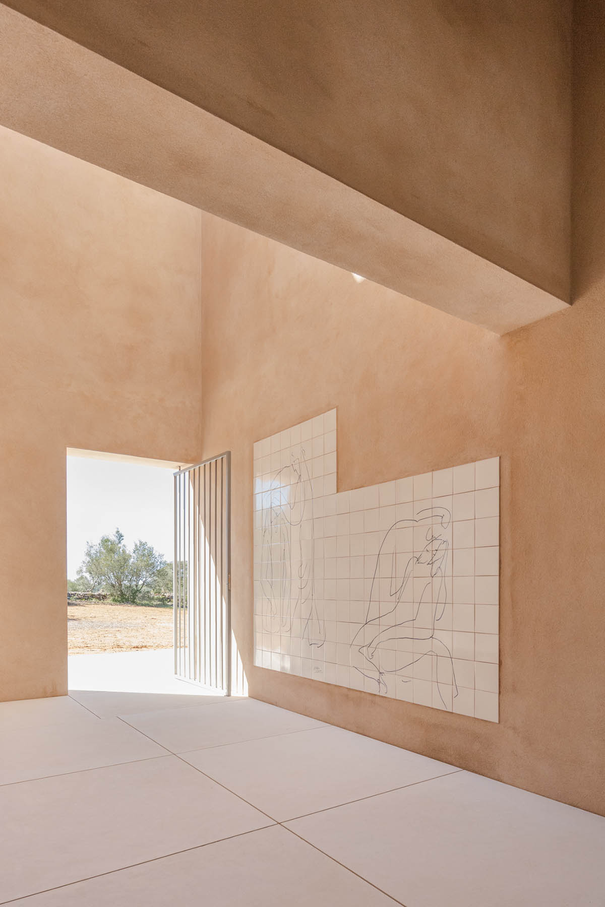 Álvaro Siza completes beige-colored Hillside Chapel in the middle of the natural landscape in Lagos