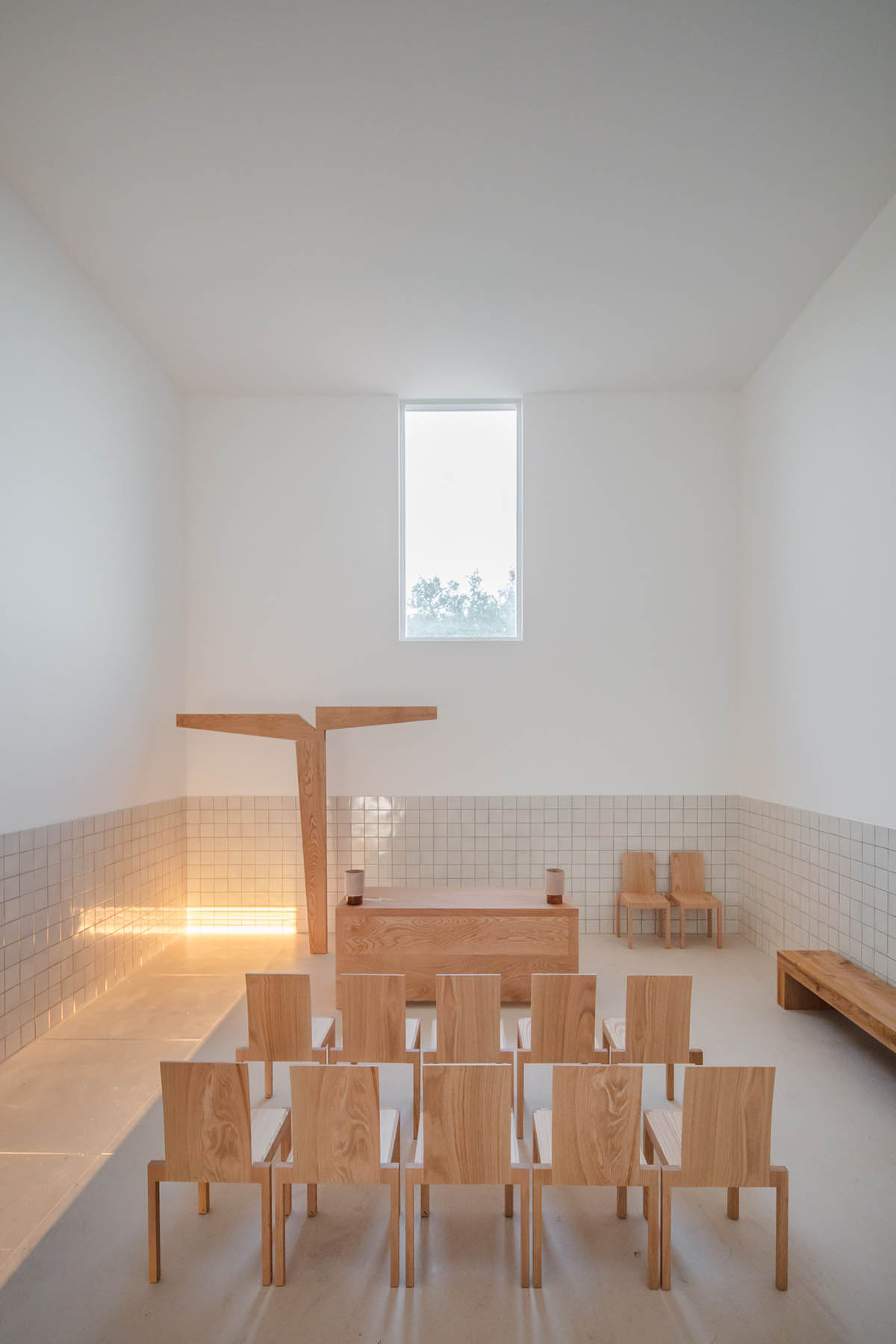 Álvaro Siza completes beige-colored Hillside Chapel in the middle of the natural landscape in Lagos