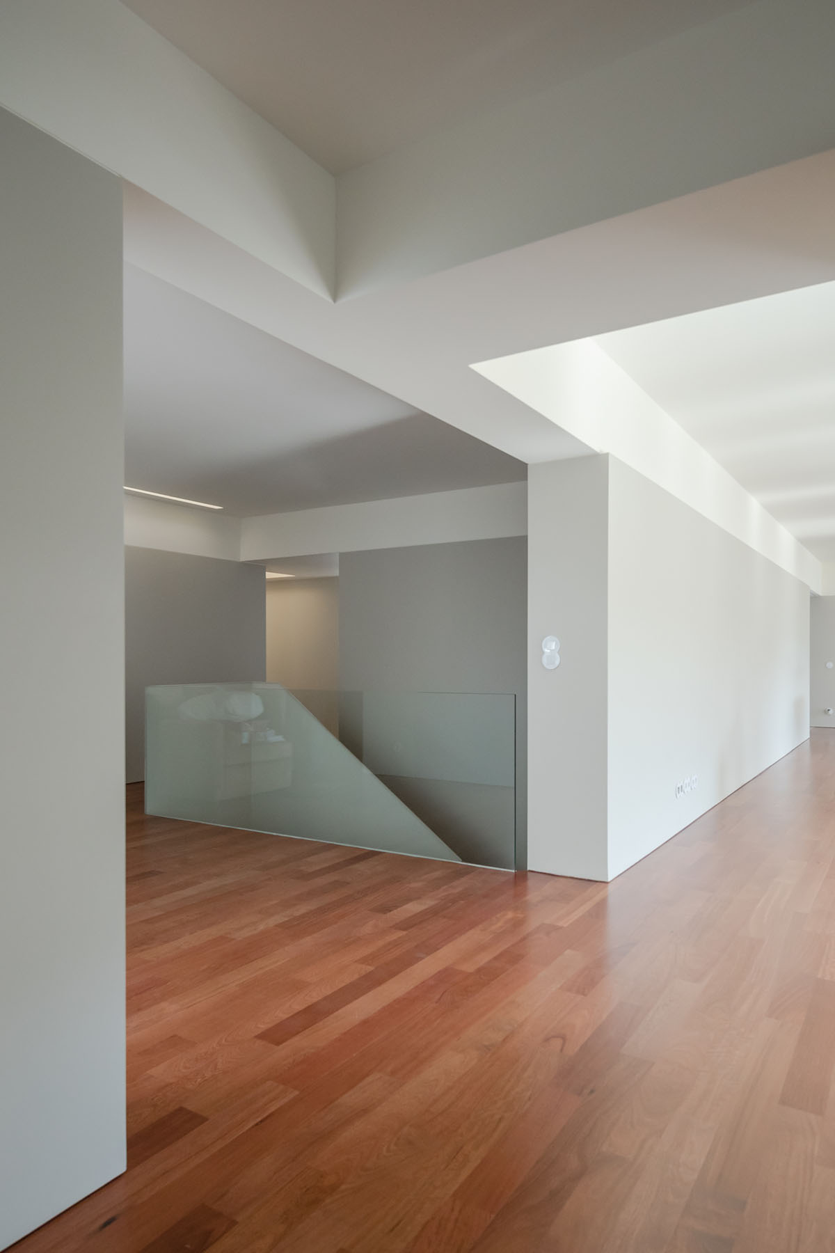 NOARQ designs smooth curvy-roof for Portuguese house to adapt to topography and create courtyards