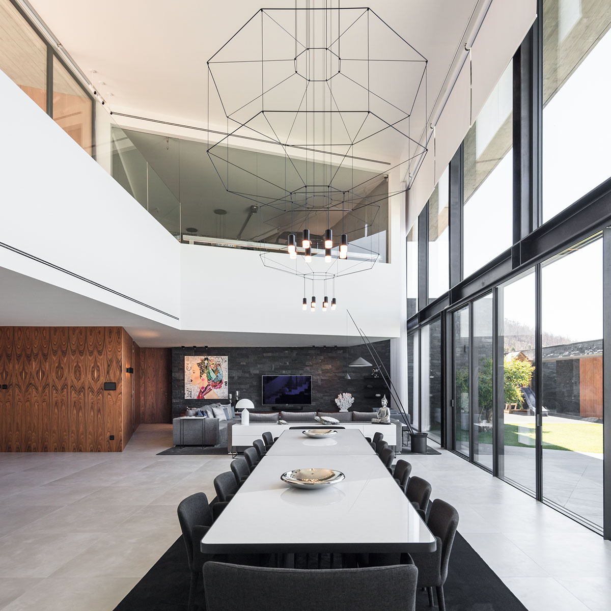 TRAMA Arquitetos completes v-shaped concrete house on hillside of Braga