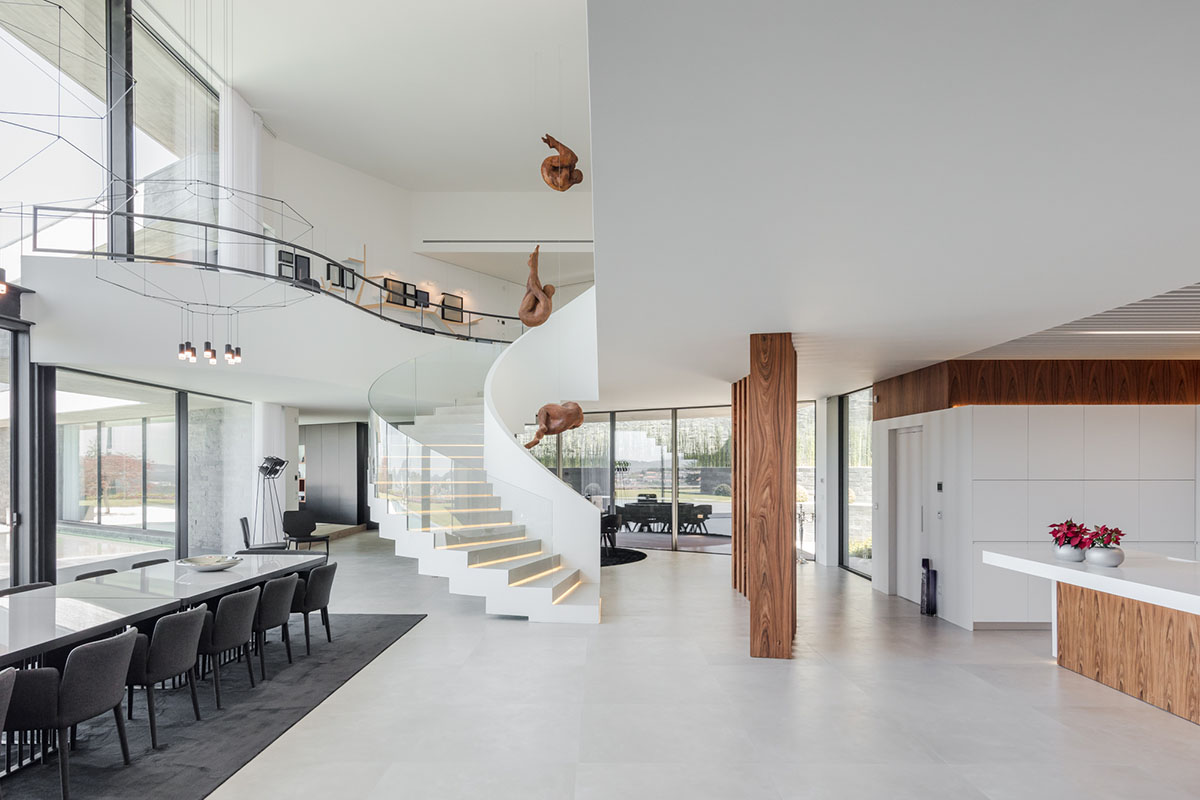 TRAMA Arquitetos completes v-shaped concrete house on hillside of Braga