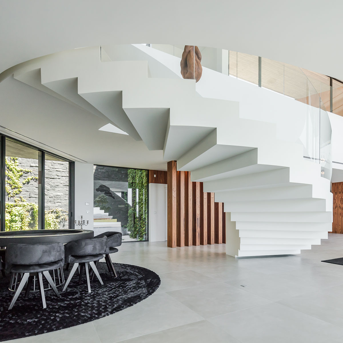 TRAMA Arquitetos completes v-shaped concrete house on hillside of Braga