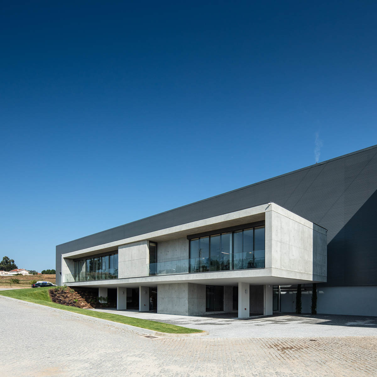 Ana Coelho Arquitectura converts old industrial complex into office  building with elongated volume