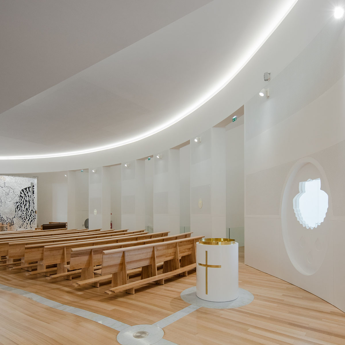 Hugo Correia completes elliptical church featuring sharp concrete lines in Portugal