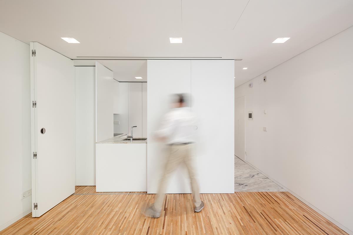 Plano Humano Arquitectos creates dynamic building with automated wooden shutters in Lisboa