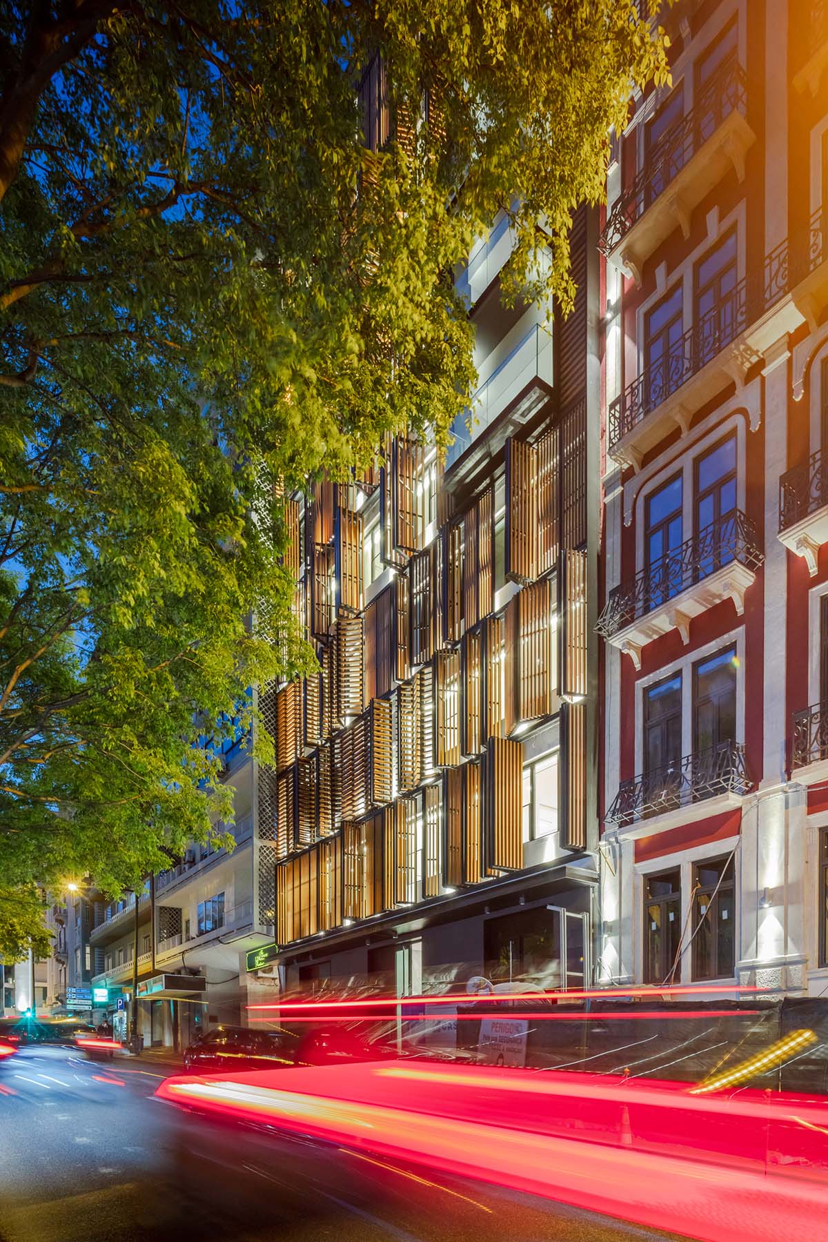 Plano Humano Arquitectos creates dynamic building with automated wooden shutters in Lisboa