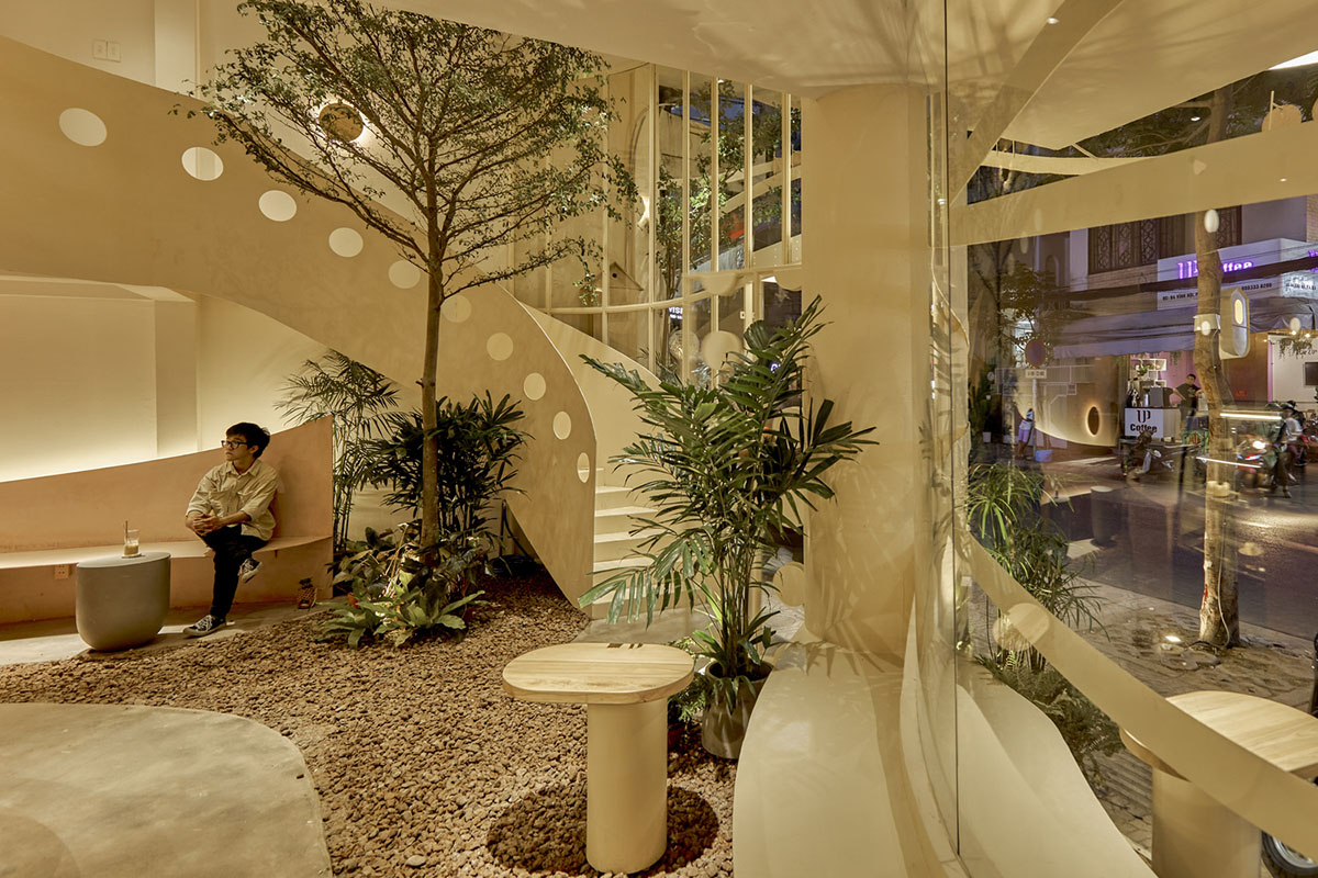 September Cafe is designed to look like a bird's nest with curved steel stripes in Vietnam