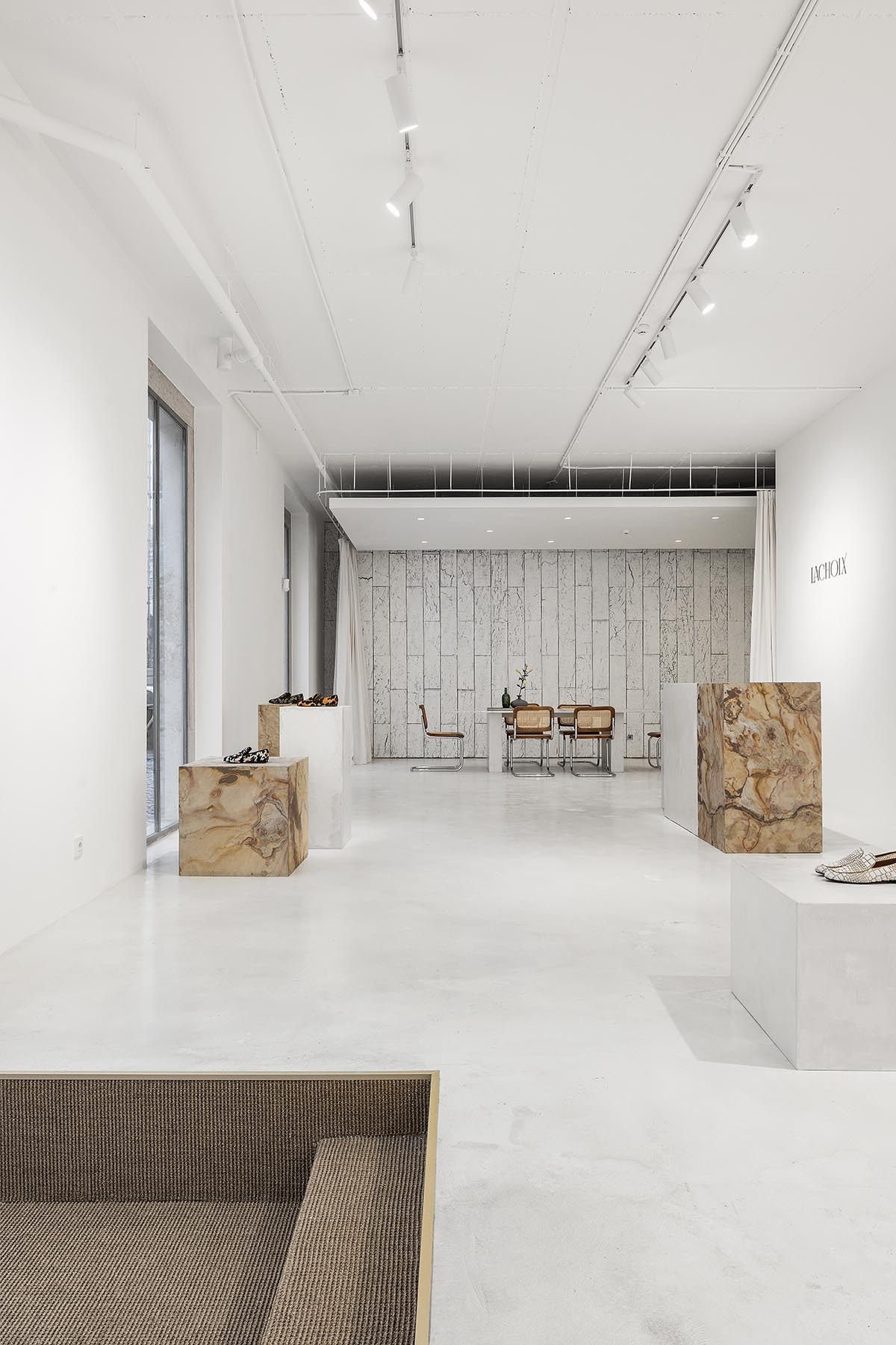 Atelier Holcnerova creates a gallery-like concept store for a shoe brand in Lisbon 