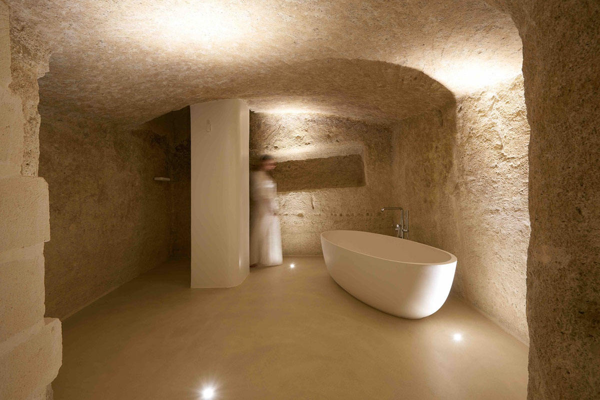 Interiors of this cave hotel and spa by Simone Micheli act like work of art with excavated surfaces