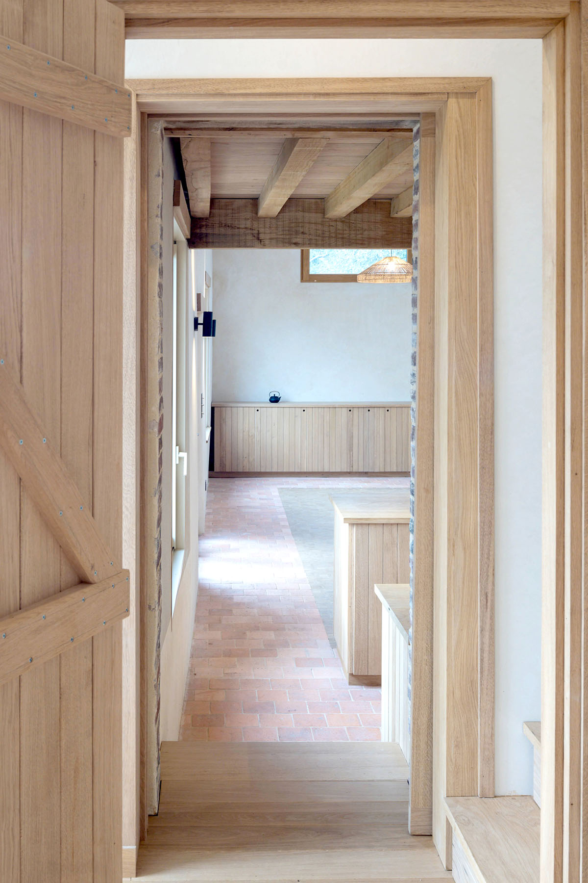 Rural house is renovated with 100 per cent local materials by Anatomies d’Architecture in Normandy