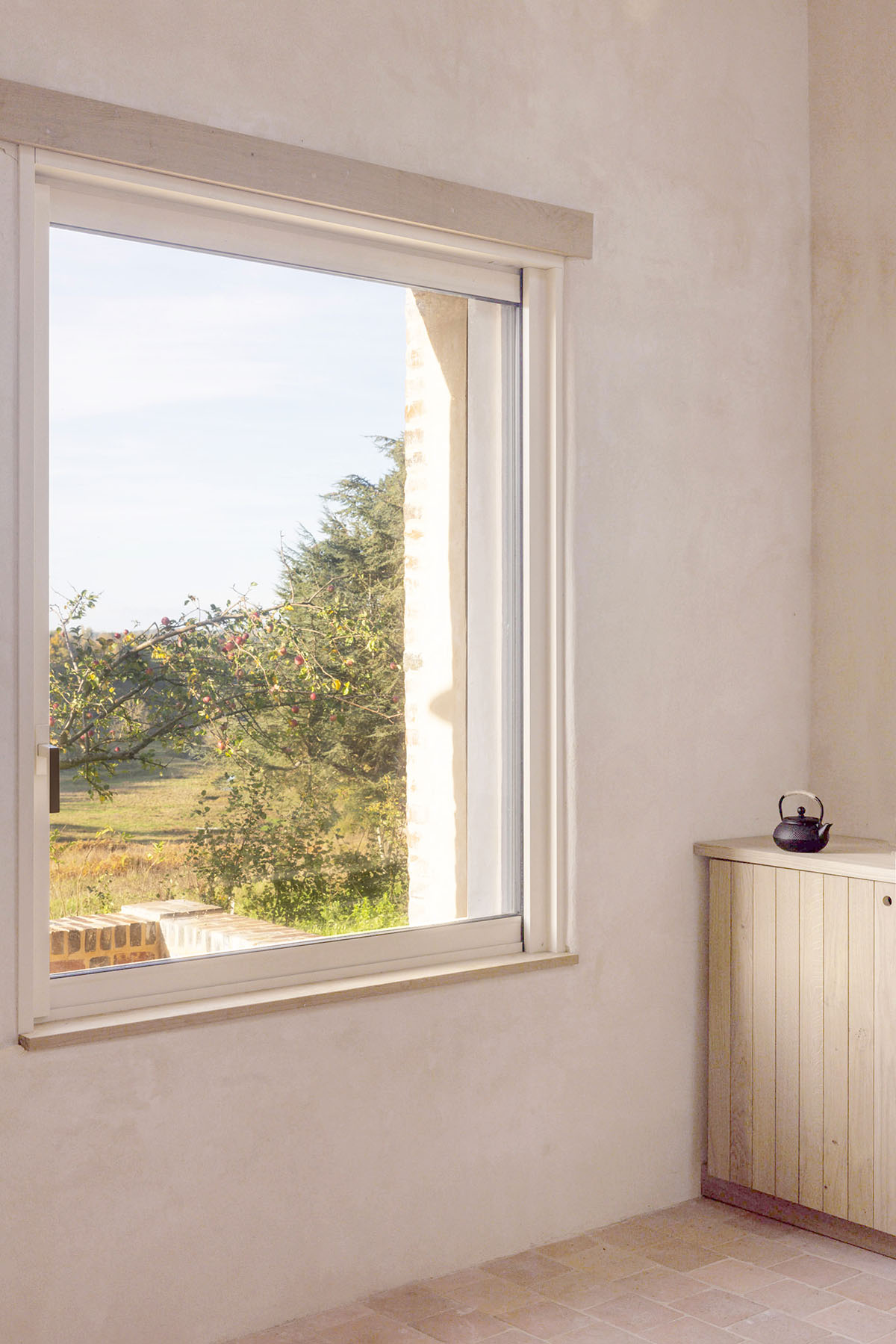 Rural house is renovated with 100 per cent local materials by Anatomies d’Architecture in Normandy