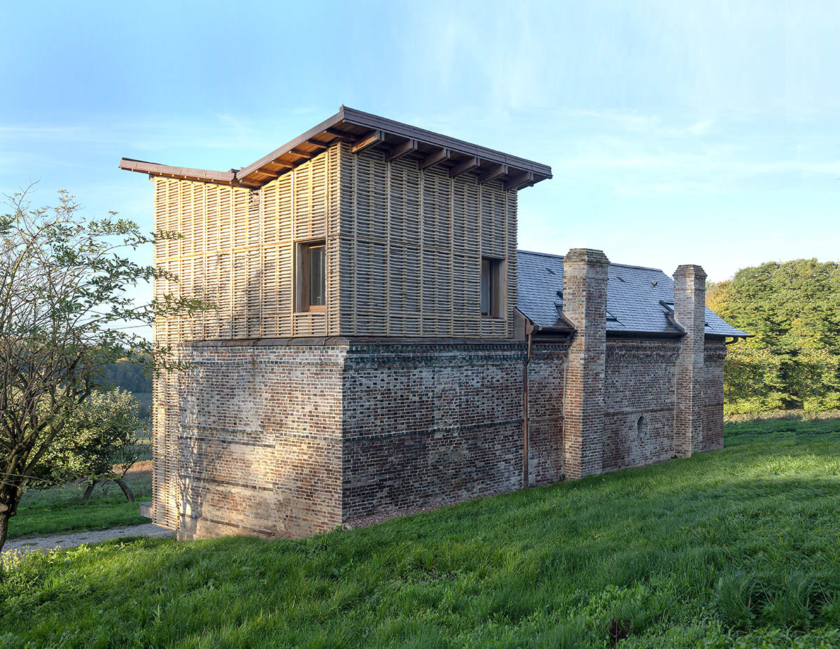 Rural house is renovated with 100 per cent local materials by Anatomies d’Architecture in Normandy