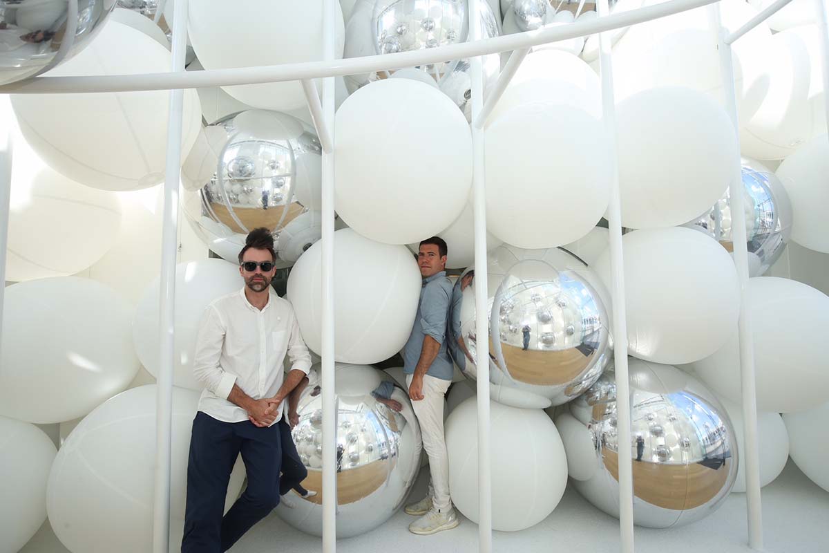 Snarkitecture fills giant steel cage with white bouncy balls at Harbour City of Hong Kong