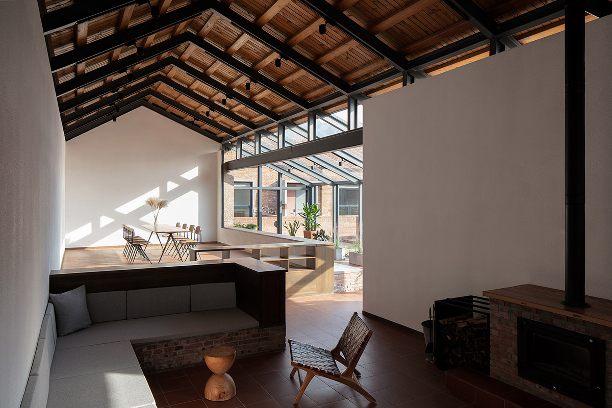 REDe Architects and Moguang Studio add red circular platform to renovated youth activity center