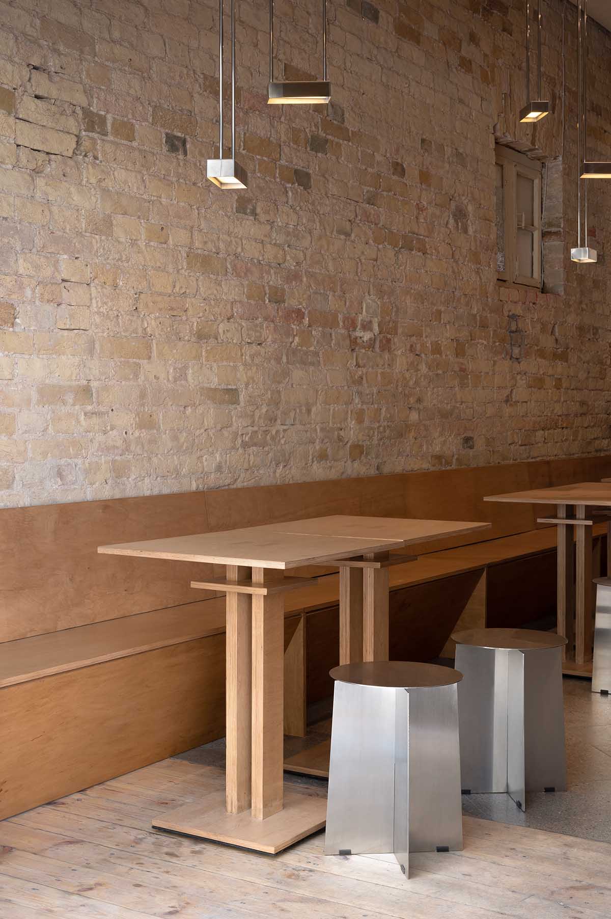 Nastia Mirzoyan completes restaurant and bar with sand-coloured bricks and stainless steel in Kyiv 