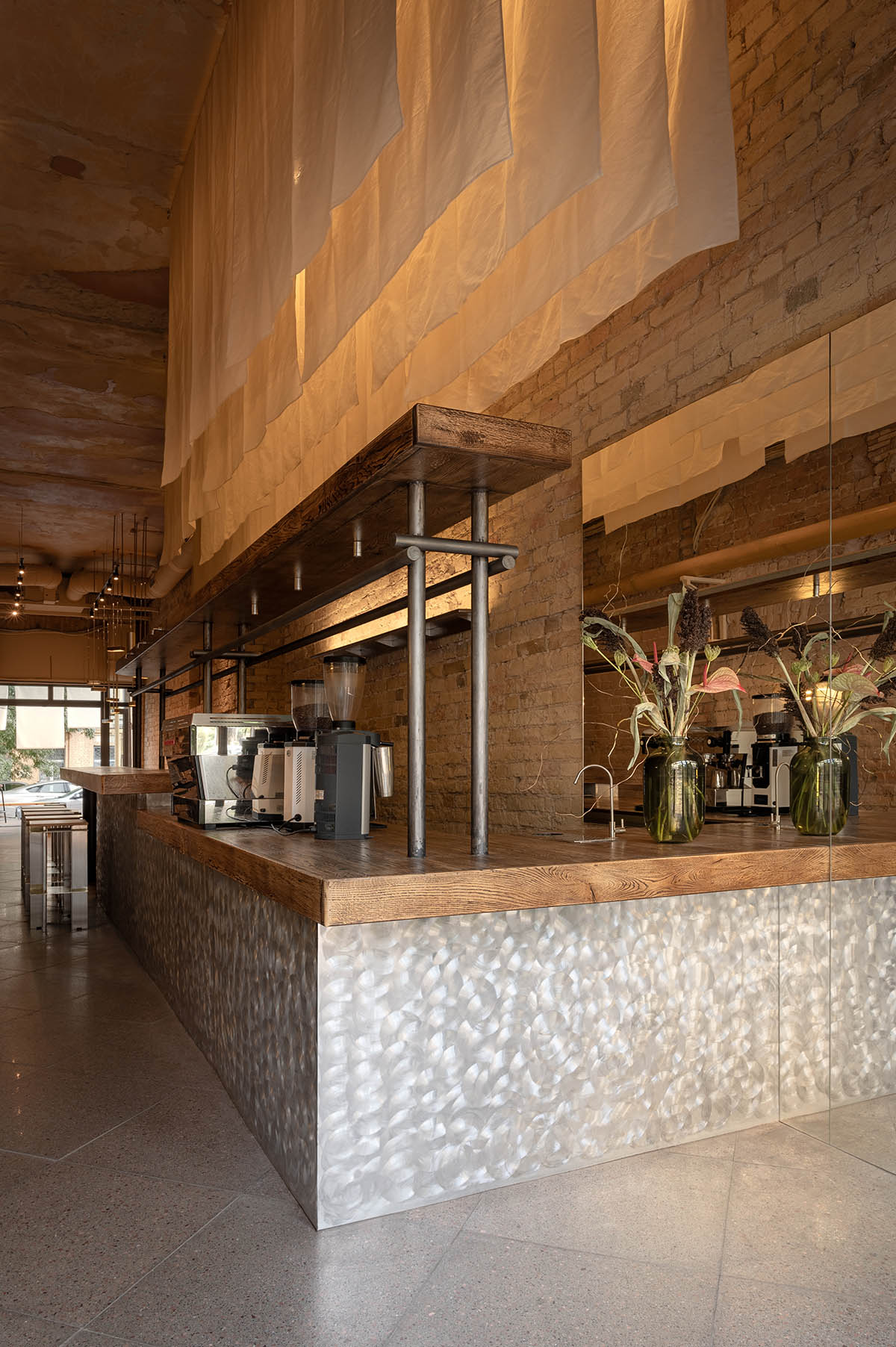 Nastia Mirzoyan completes restaurant and bar with sand-coloured bricks and stainless steel in Kyiv 