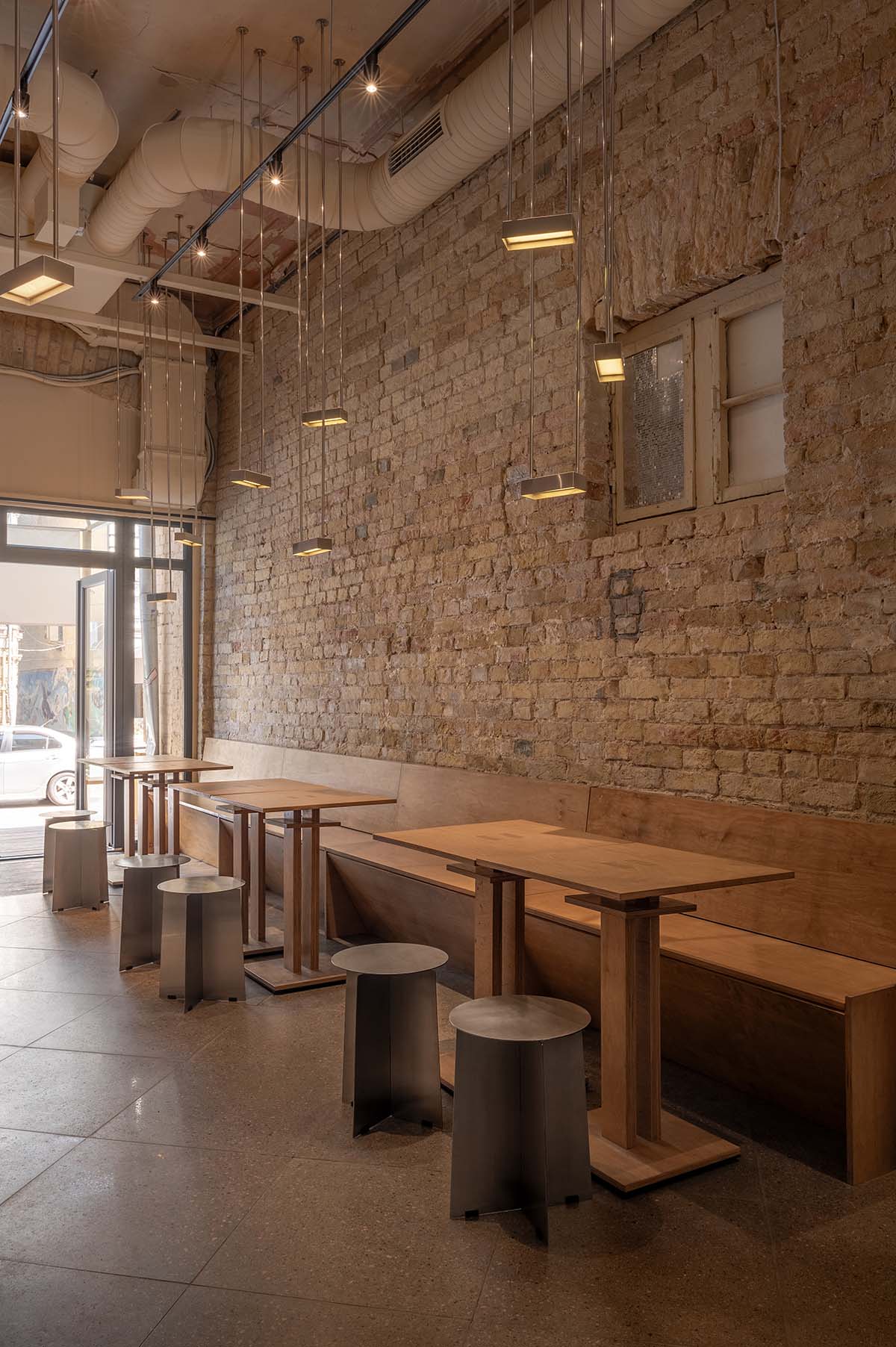 Nastia Mirzoyan completes restaurant and bar with sand-coloured bricks and stainless steel in Kyiv 