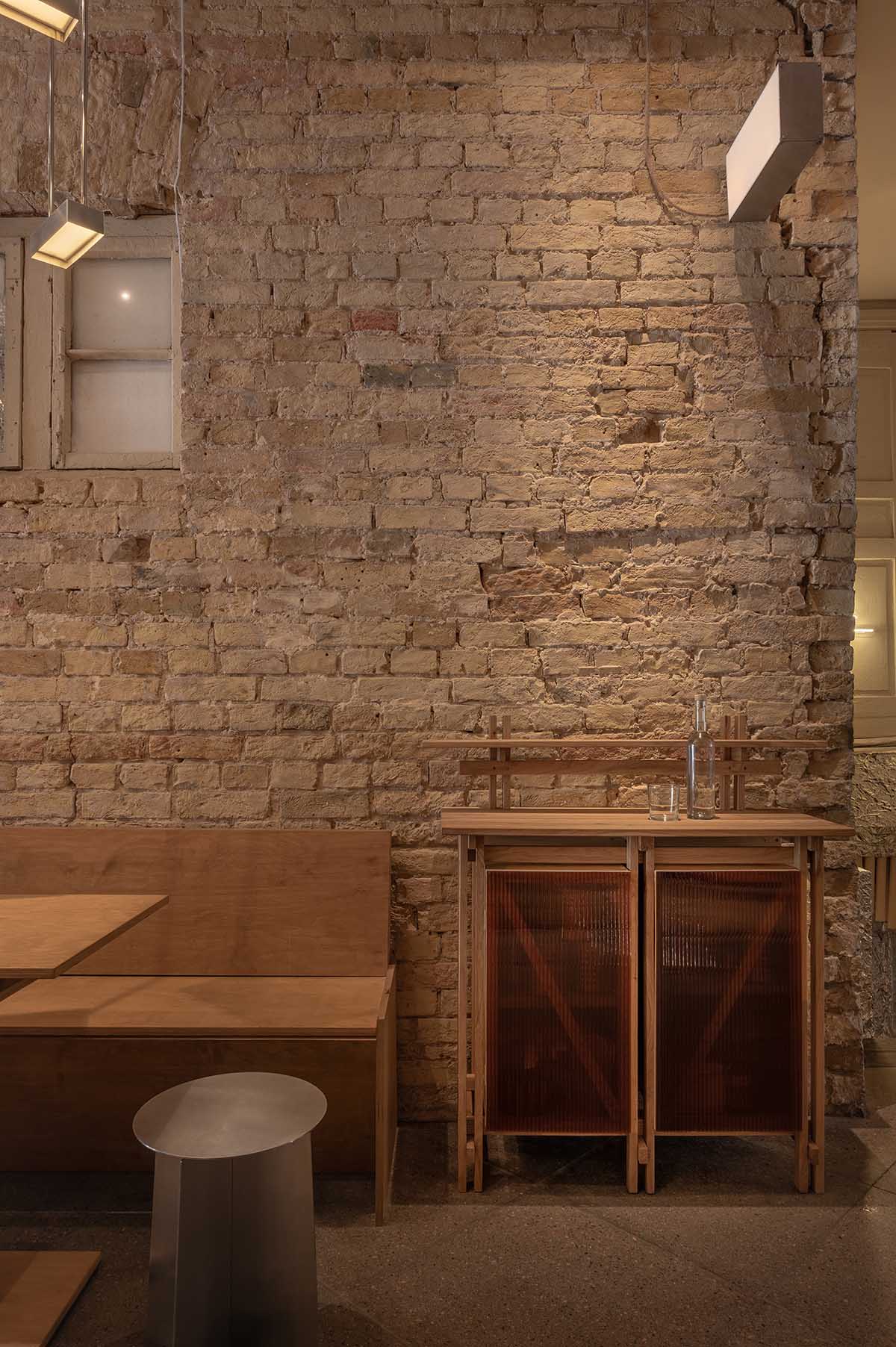 Nastia Mirzoyan completes restaurant and bar with sand-coloured bricks and stainless steel in Kyiv 