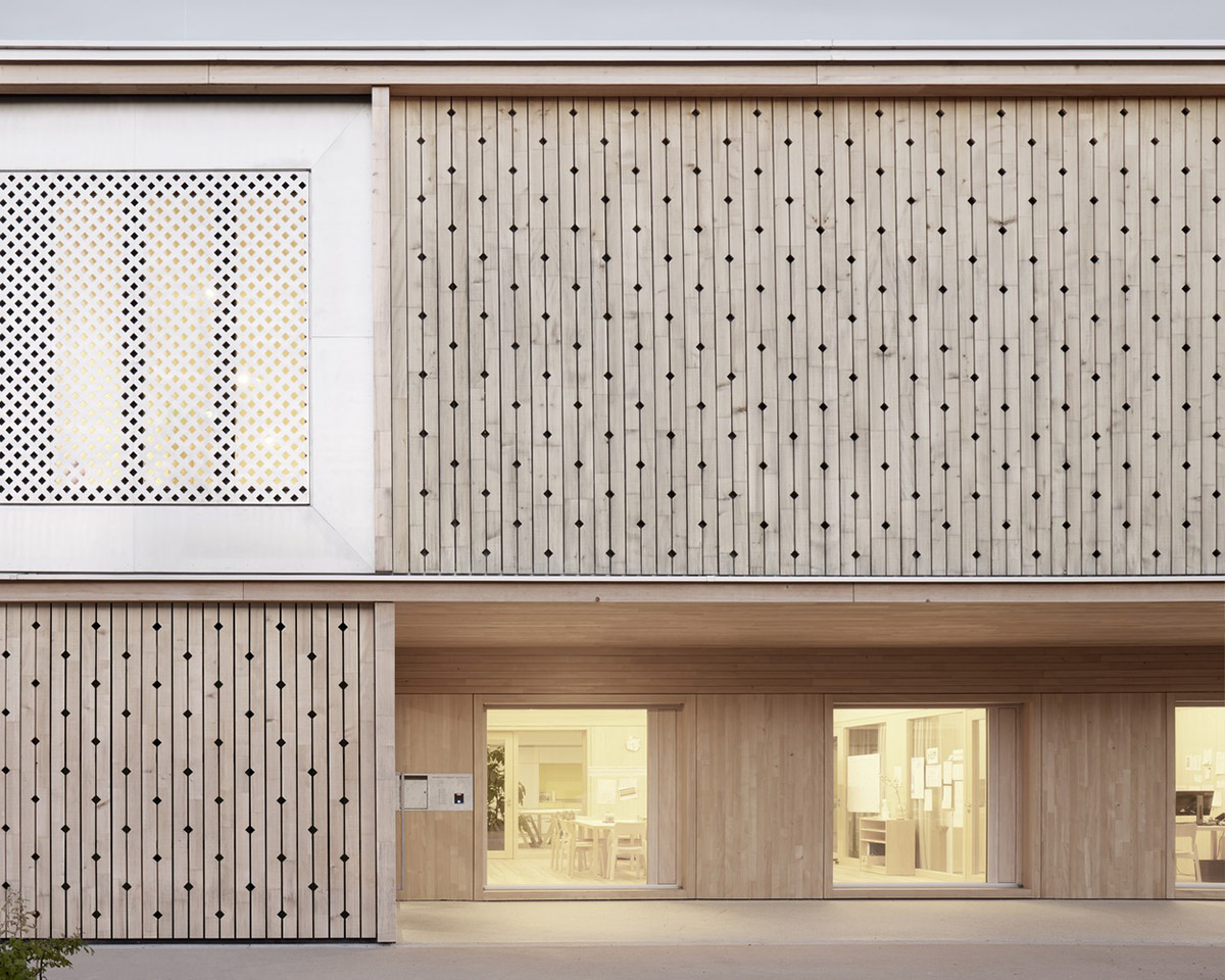 Innauer-Matt Architekten designs kindergarten with large pointed windows and wall motifs in Austria