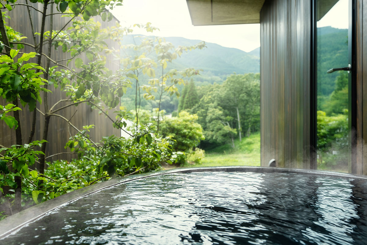 Kengo Kuma & Associates completes hot spring resort surrounded by cascading rice terraces in Kyushu