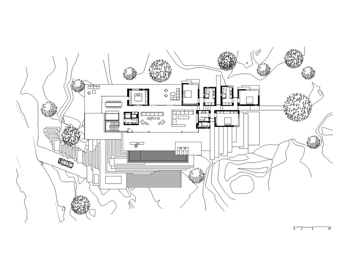 Karim Nader Studio built retreat expanding landscape with dispersed boxes and zinc roof on the rocks