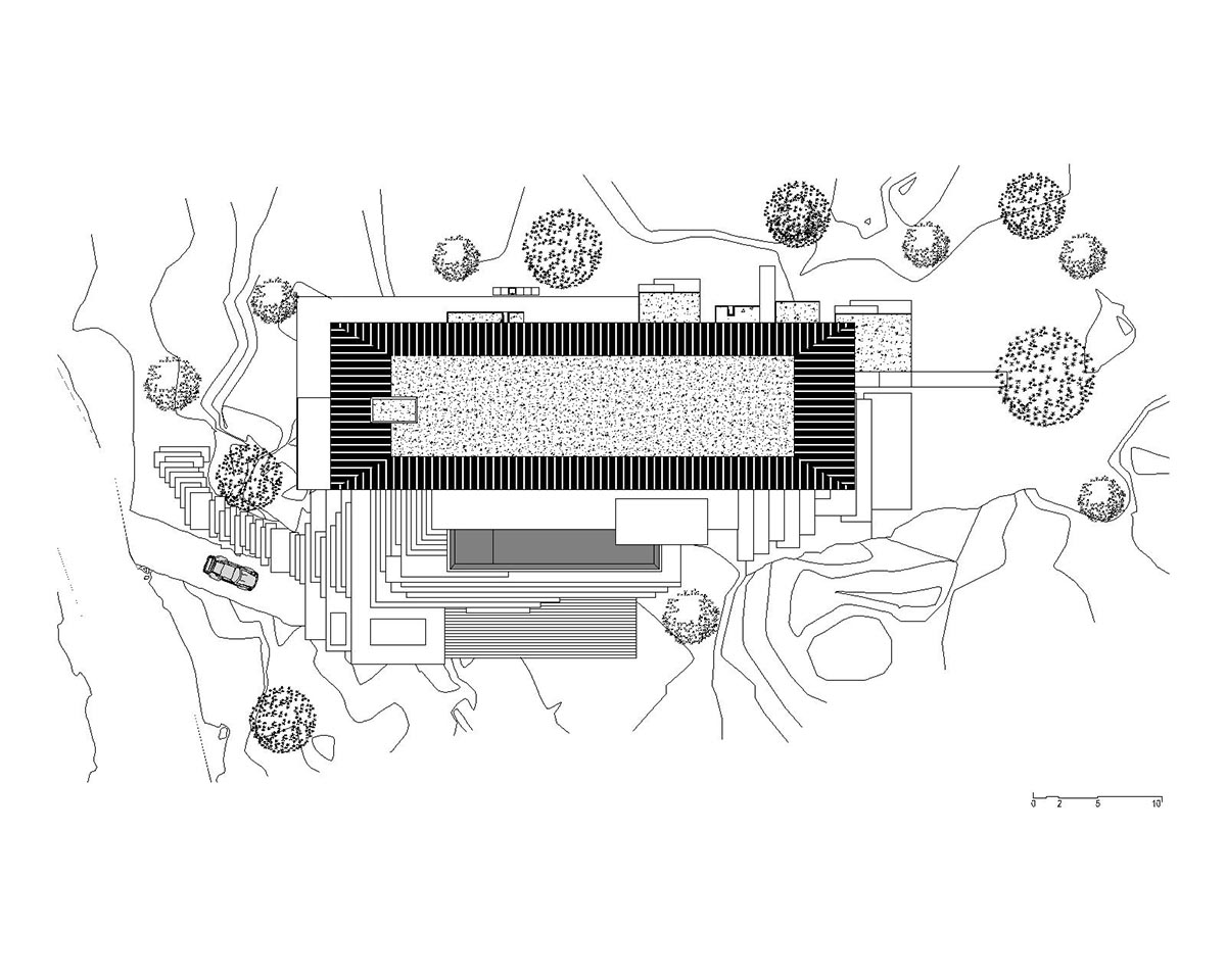 Karim Nader Studio built retreat expanding landscape with dispersed boxes and zinc roof on the rocks