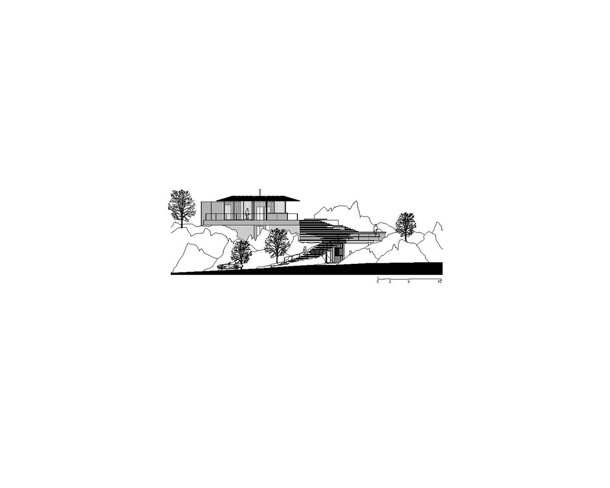 Karim Nader Studio built retreat expanding landscape with dispersed boxes and zinc roof on the rocks