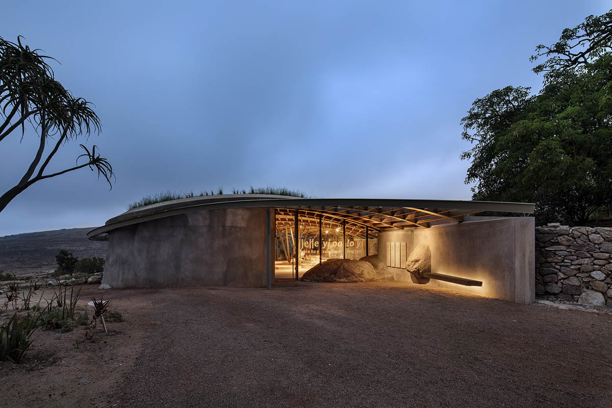 KLG Architects completes heritage center with undulating roof that acts as a small shelter