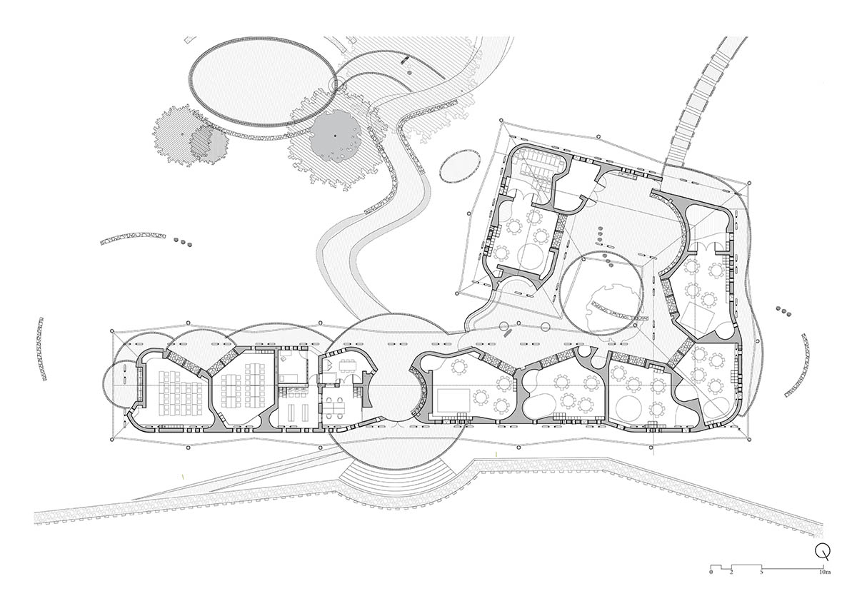 Localworks built junior school with organically shaped classrooms made of earthbags in Uganda 