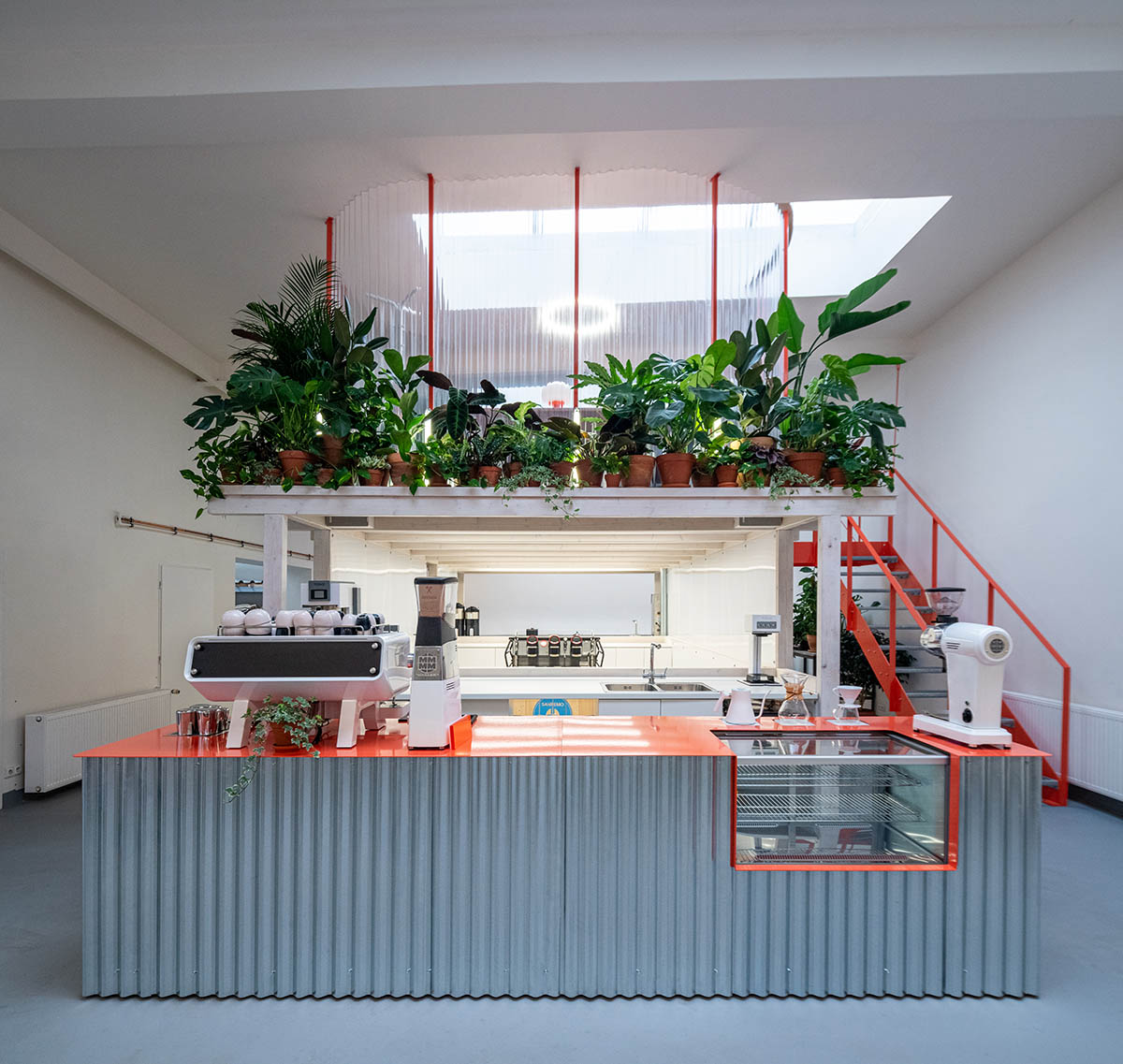 KOGAA crowns Prague's industrial coffee hub with additional working space filled with loop of plants