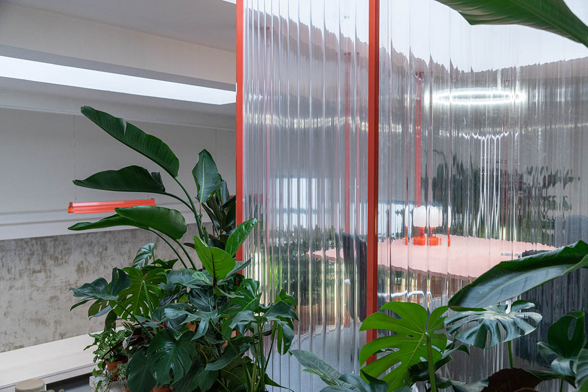 KOGAA crowns Prague's industrial coffee hub with additional working space filled with loop of plants