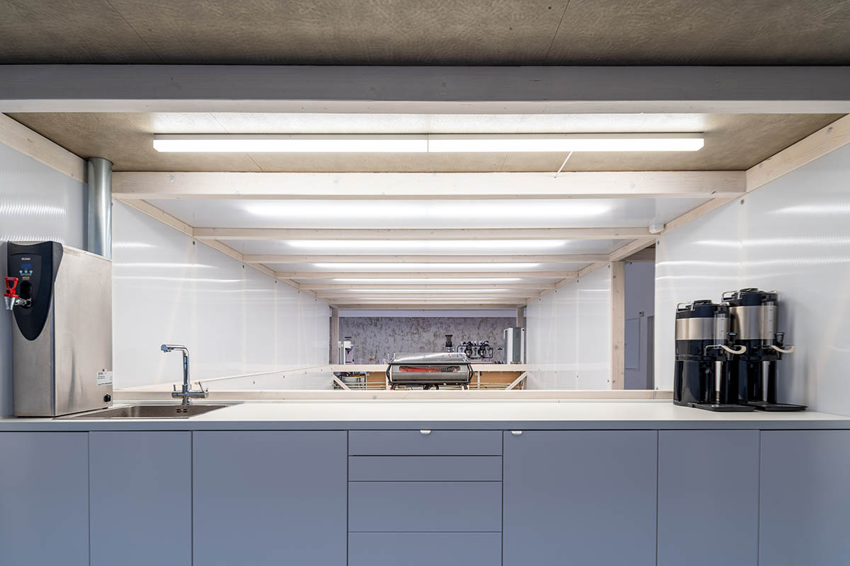 KOGAA crowns Prague's industrial coffee hub with additional working space filled with loop of plants