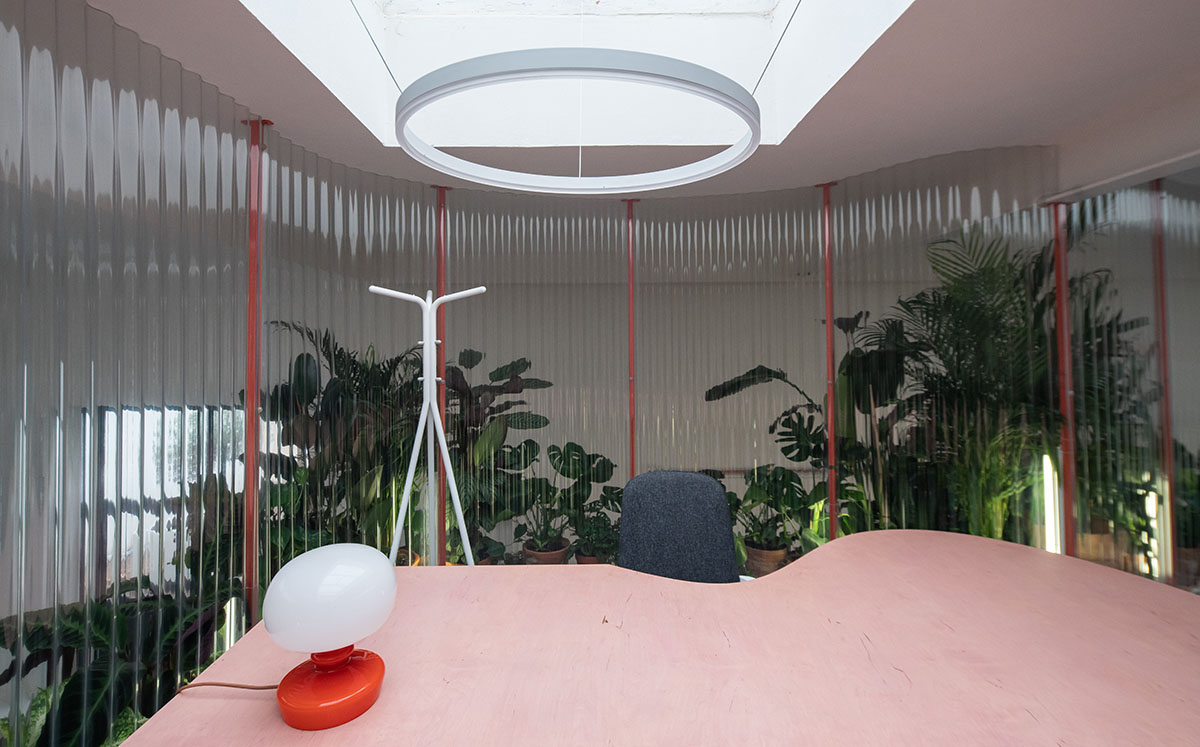 KOGAA crowns Prague's industrial coffee hub with additional working space filled with loop of plants