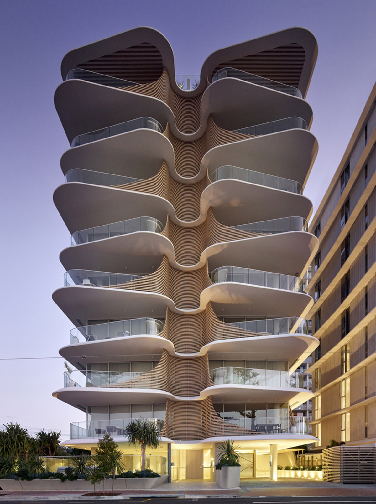 Residential building in Australia features sculptural and wavy façade inspired by Norfolk pines 