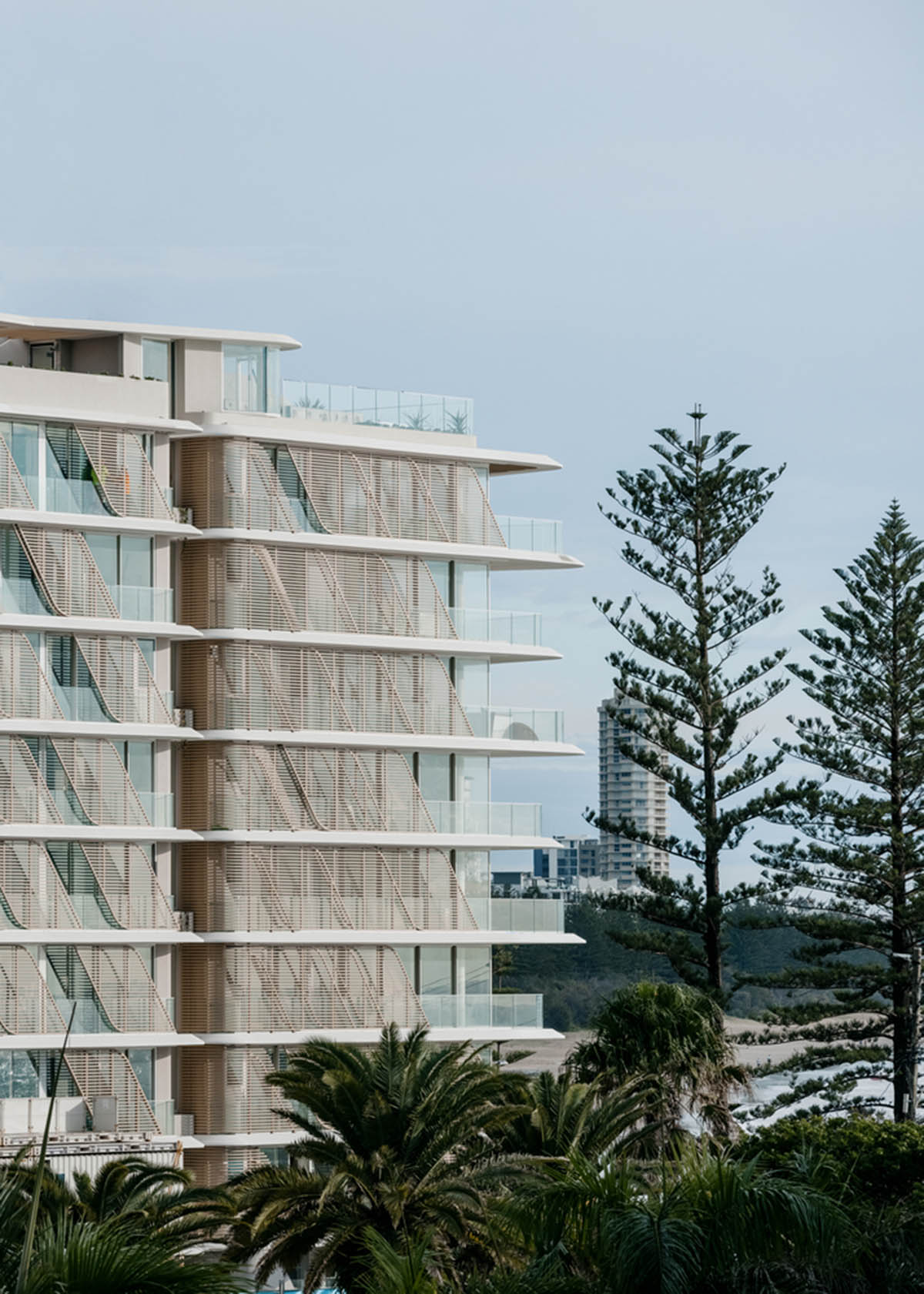 Residential building in Australia features sculptural and wavy façade inspired by Norfolk pines 