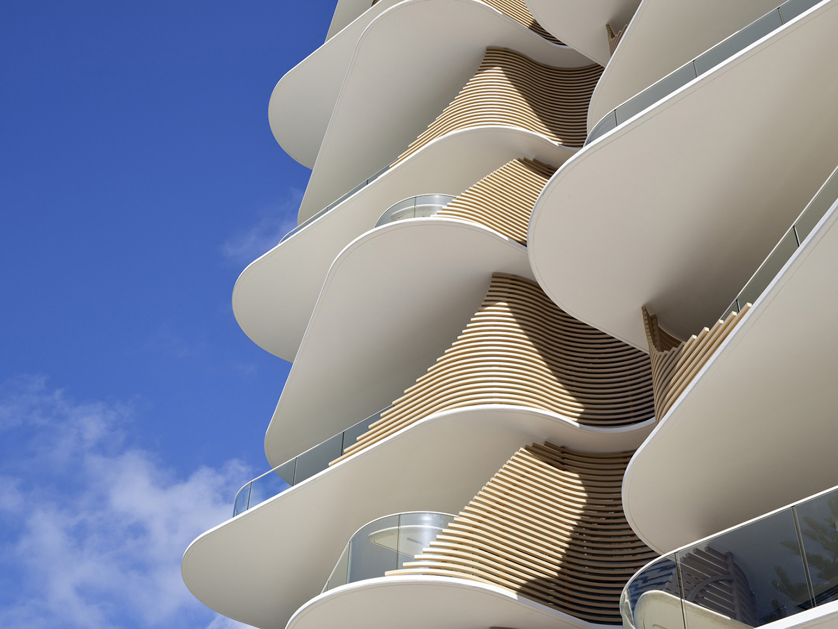 Residential building in Australia features sculptural and wavy façade inspired by Norfolk pines 