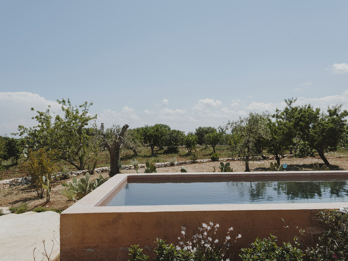 Villa Cardo featuring all-white walls looks like a small castle among ...