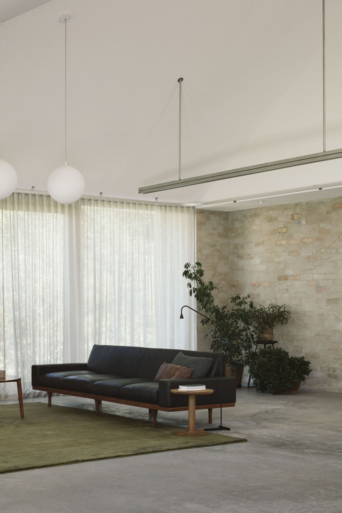 Textured brick walls reflects light, colour and textures of Autumn in Kyneton House by Edition Office