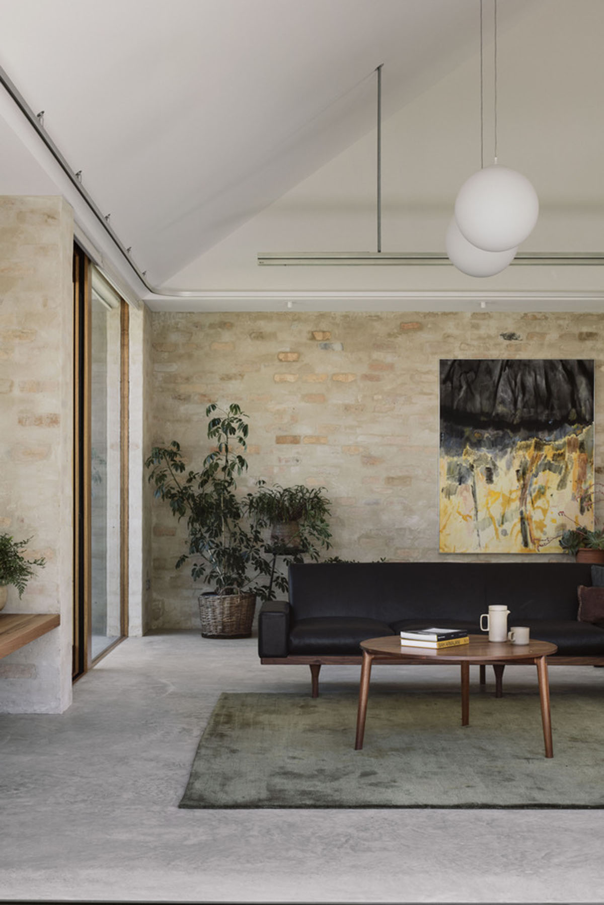 Textured brick walls reflects light, colour and textures of Autumn in Kyneton House by Edition Office