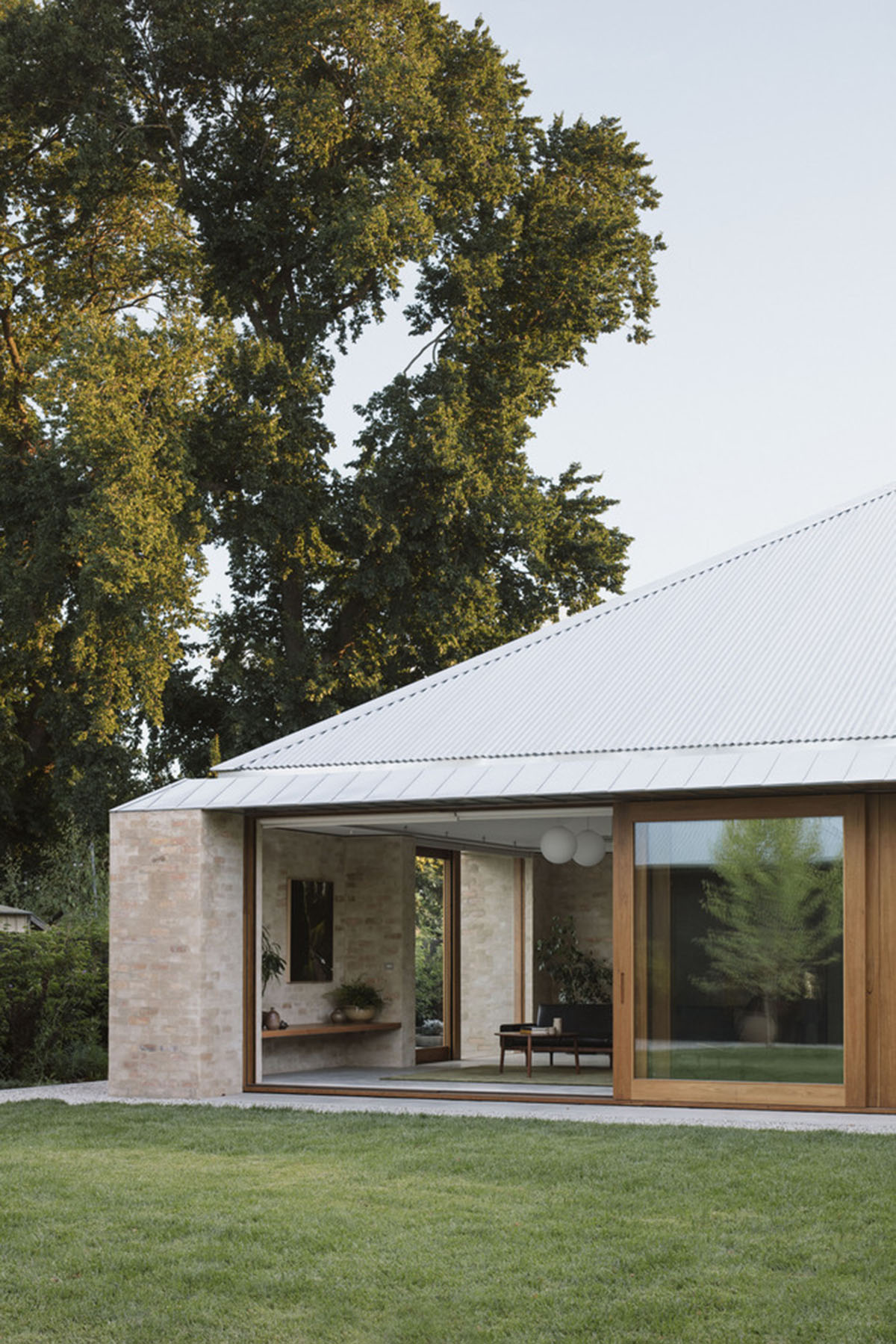 Textured brick walls reflects light, colour and textures of Autumn in Kyneton House by Edition Office