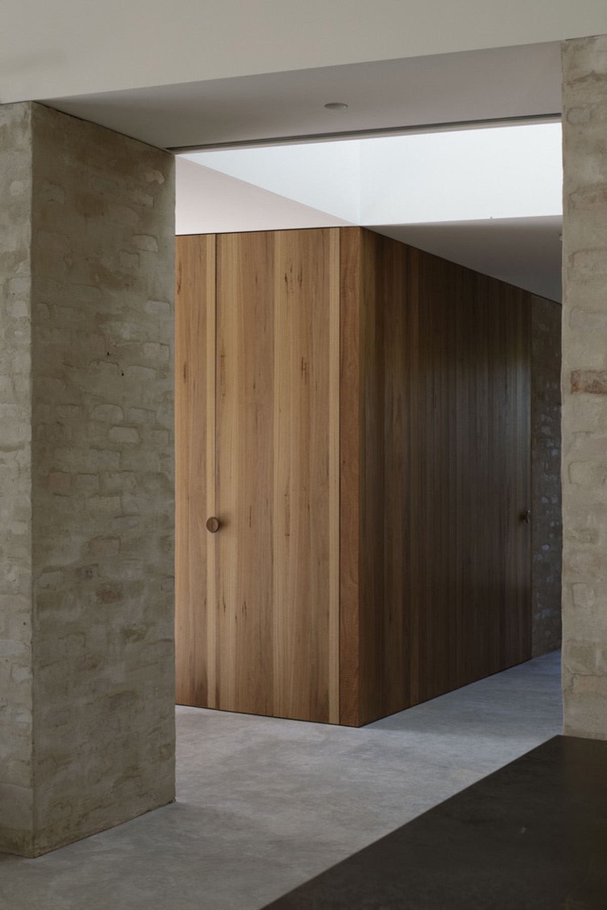 Textured brick walls reflects light, colour and textures of Autumn in Kyneton House by Edition Office