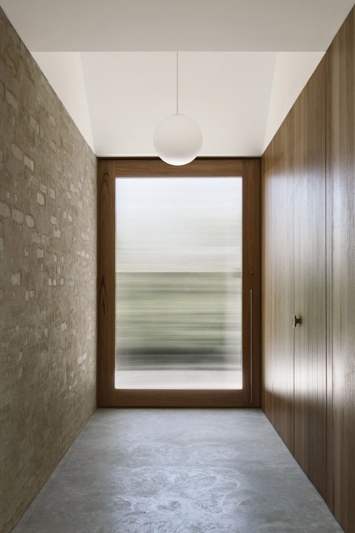 Textured brick walls reflects light, colour and textures of Autumn in Kyneton House by Edition Office