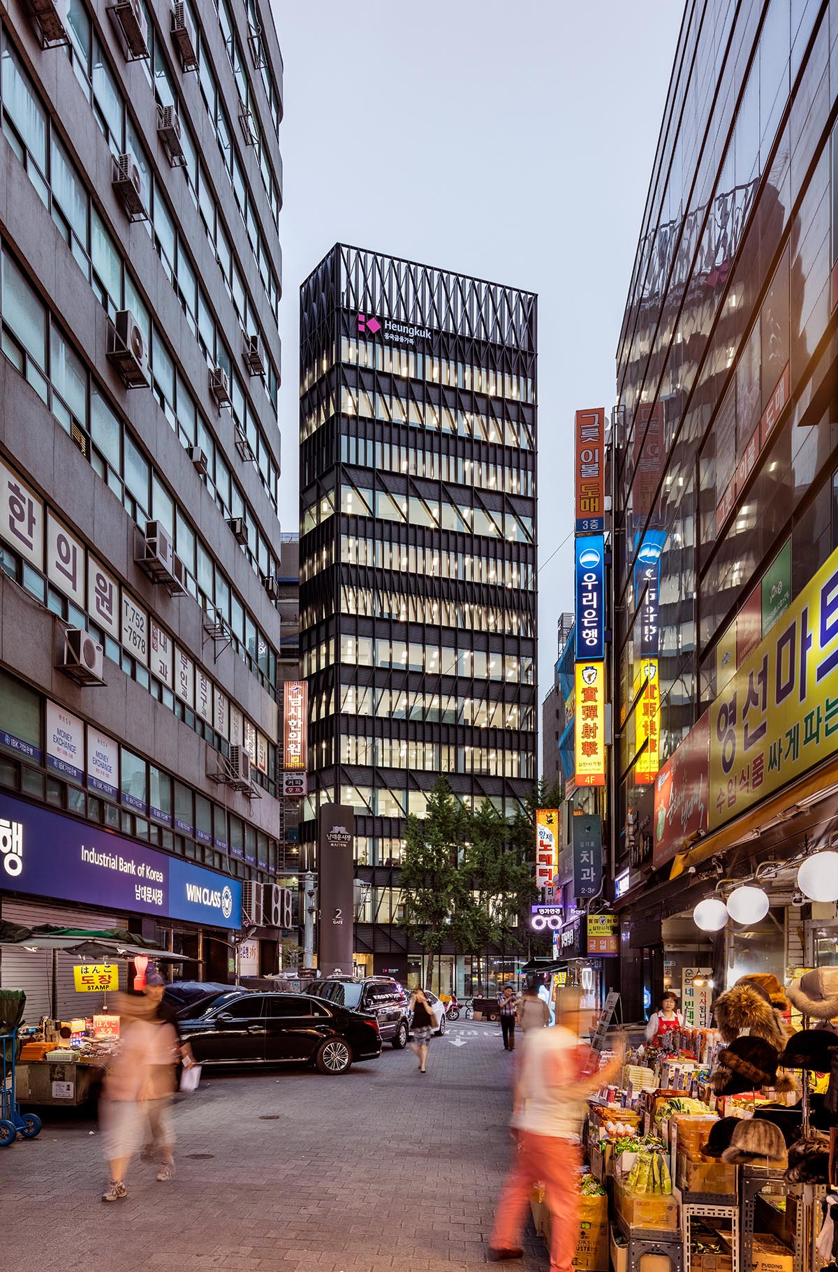 Mecanoo completes its first Seoul office tower with black linear patterns