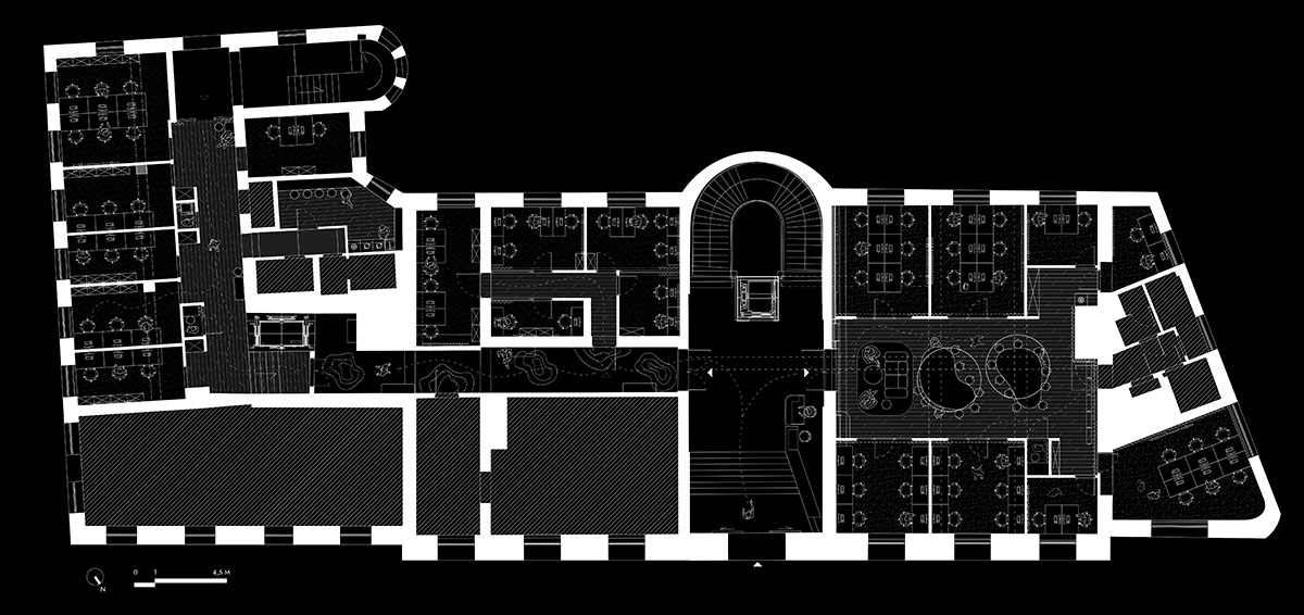 This copper-hued co-working space interior is designed to inspire creative work in Wrocław