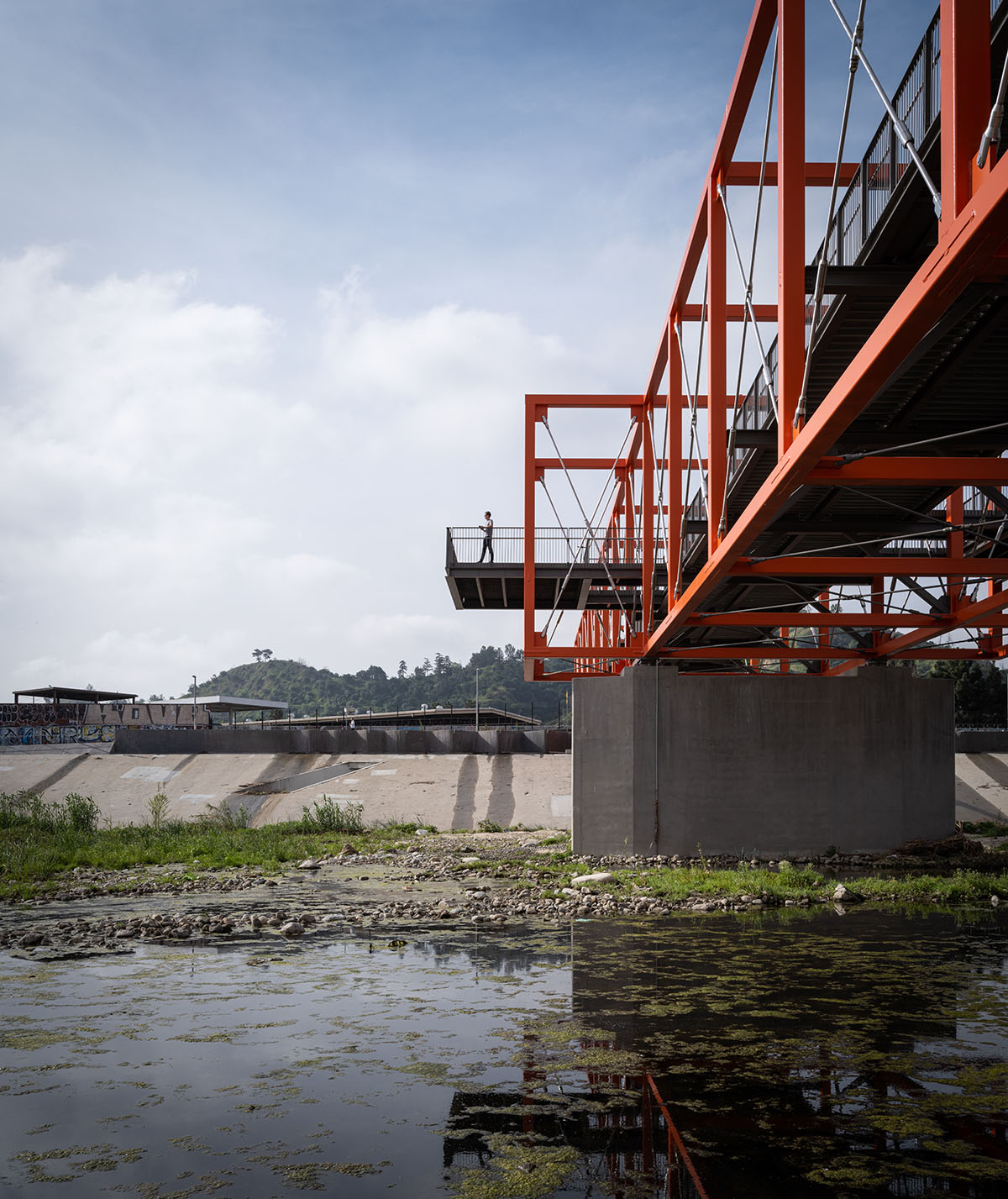 SPF:architects completes bicycle and pedestrian bridge with orange steel boxes on Los Angeles river  