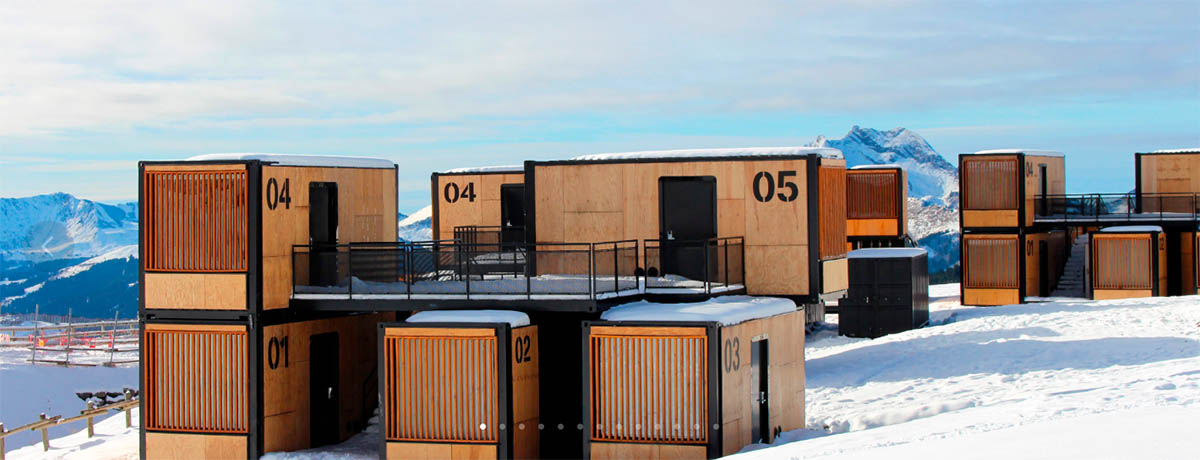 Real wooden shipping containers provide nomadic accommodation designed by Ora Ito