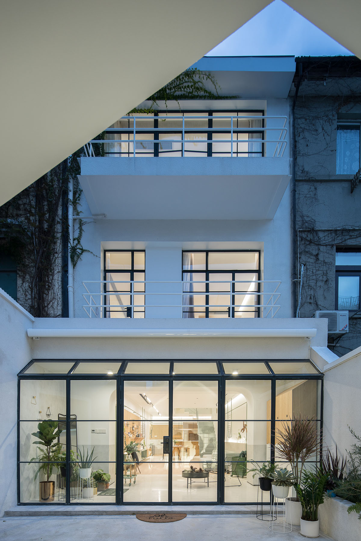 RIGI Design renovates Shanghai's historic house with punched holes and white colour palette
