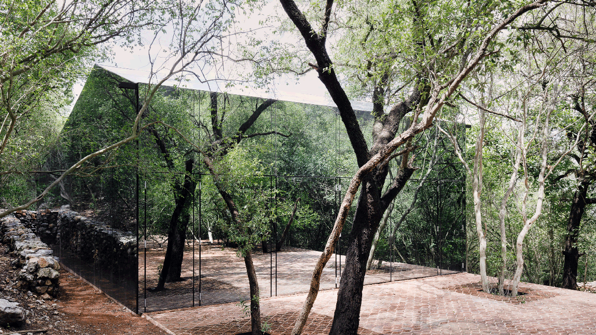 Tatiana Bilbao completes holiday dwelling that reflects its surrounding landscape with mirrored skin