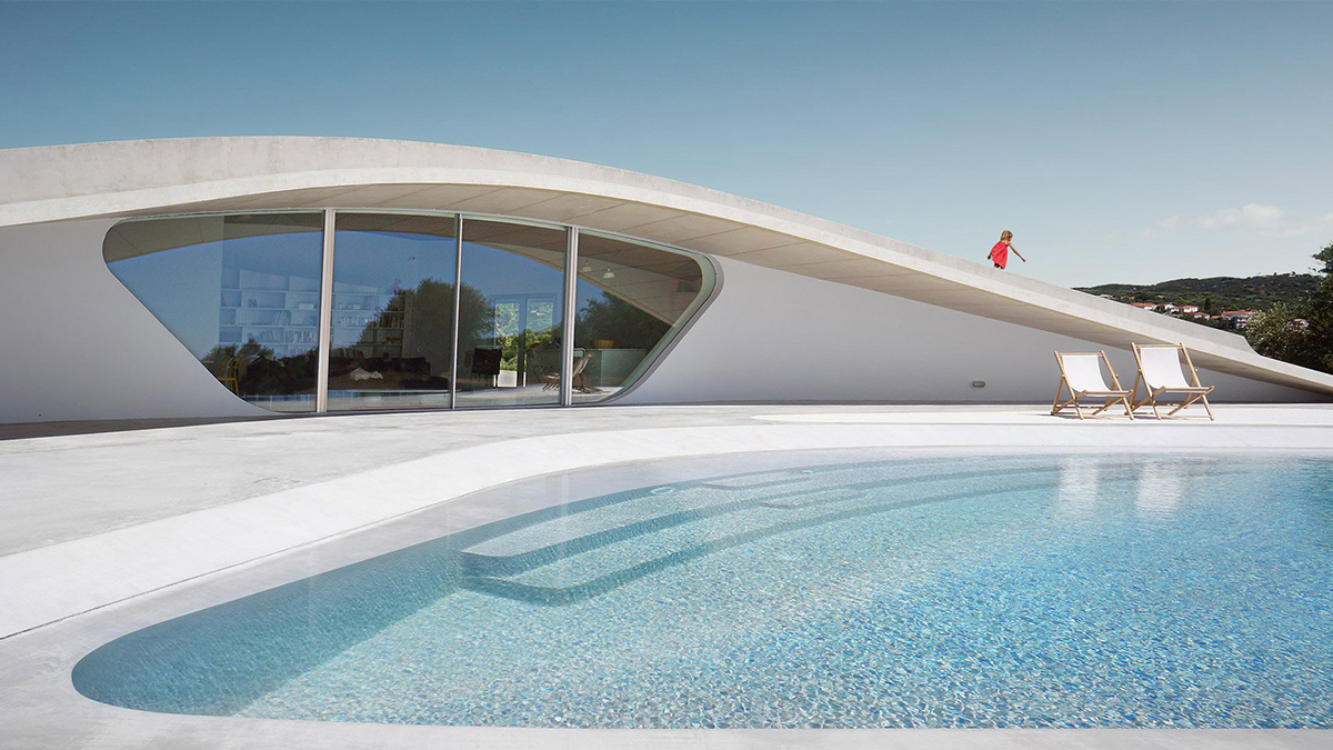 Ypsilon summer house embedded in landscape overlooking Peloponnese’s olive grove